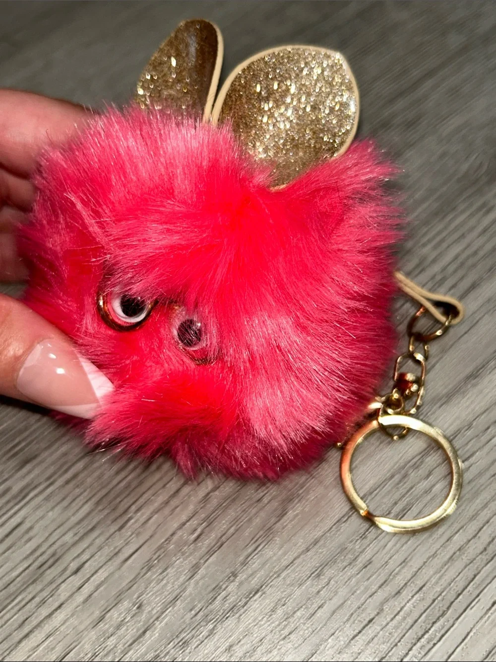 Pink Fuzzy Furby Pom Pom Keychain wearing glasses with Gold Accents